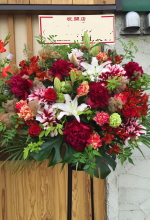 多摩市　飲食店の開店祝い　赤系お祝いスタンド花